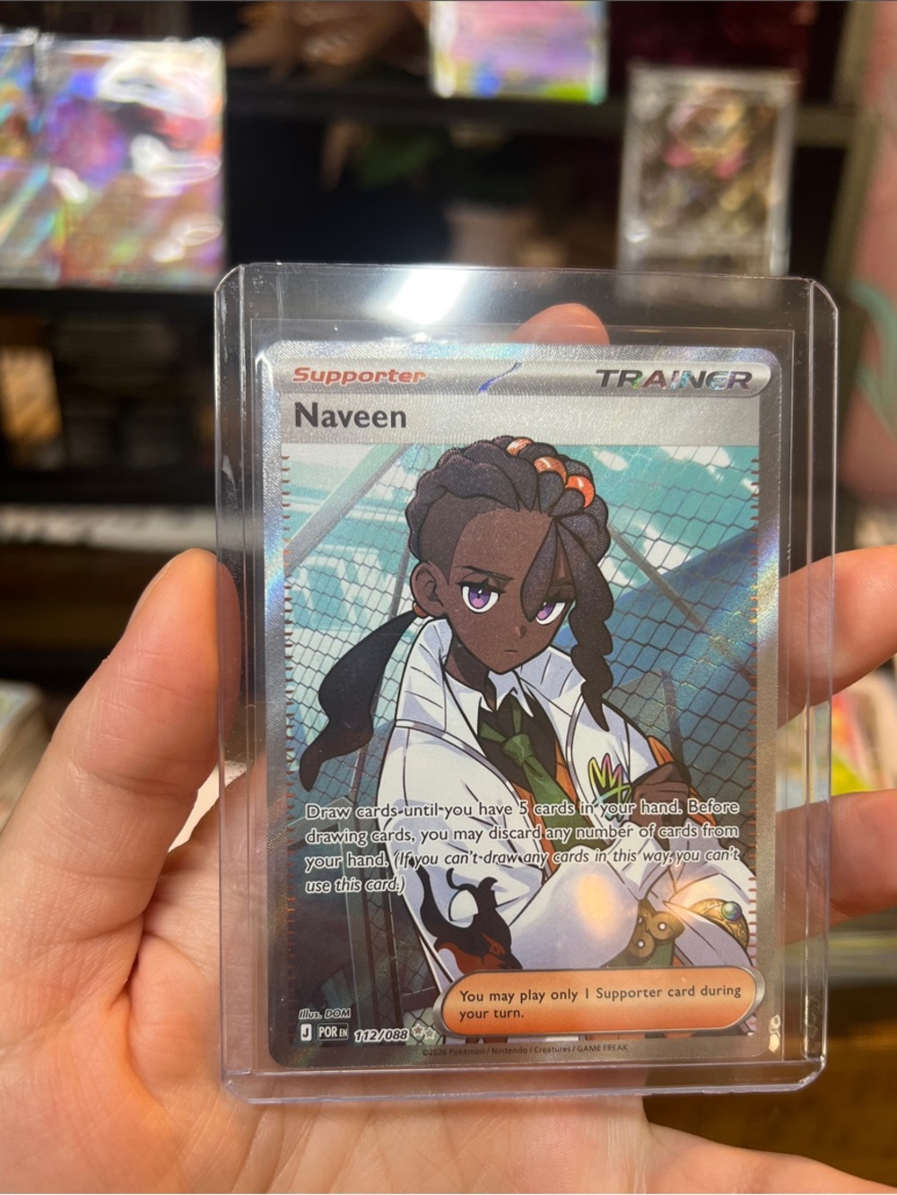 Pokemon Naveen Full Art Trainer Card — Black, White, Green Accents